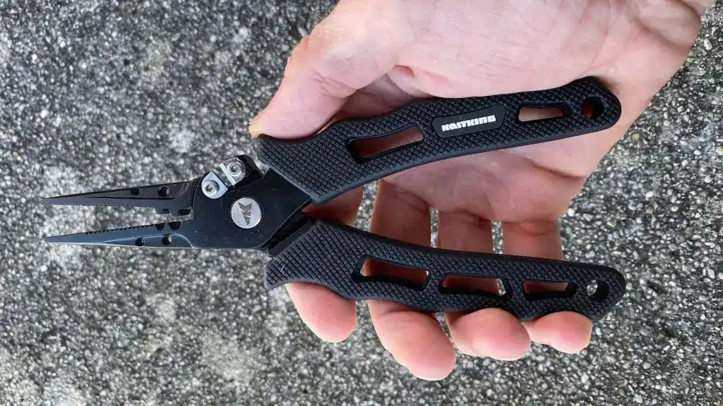 Black multi-tool pliers with textured grip handles.