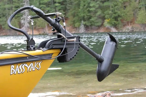 Electric trolling motor mounted on a yellow kayak.