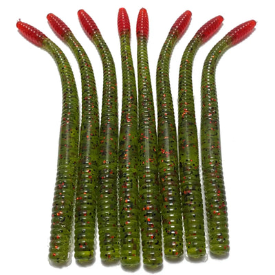 Green and red plastic fishing worms arranged in a row.