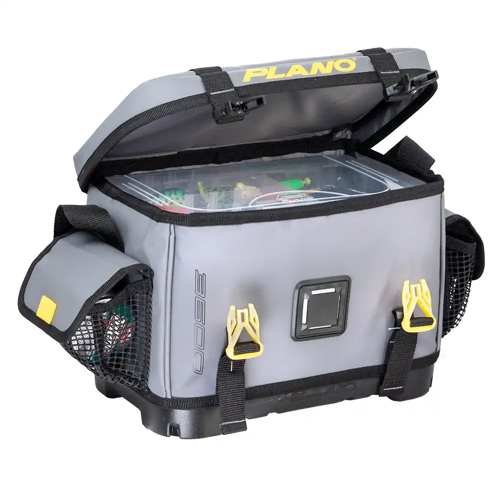 Grey fishing tackle bag with yellow buckles and mesh pockets.