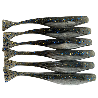 Six dark plastic fishing lures with sparkly flecks arranged in parallel rows.